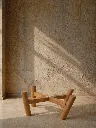 Sunlit minimalism with wooden stand.webp
