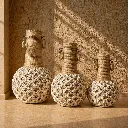 Woven vases with natural sunlight shimmer (1).webp