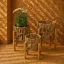 Sunlit woven pots in warm tones.webp