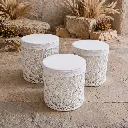Rustic macramé ottomans in natural setting.webp