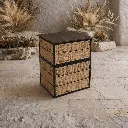 Minimalist dresser with stone and grasses.webp