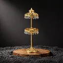 Ornate gold stand with crystal pendants.webp