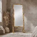 Cozy minimalist bedroom with gold mirror.webp