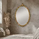Golden mirror in a cozy minimalist room.webp