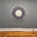 Hypnotic circular art in minimalist gallery.webp