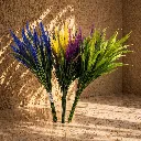Sunlit botanical arrangement on marble.webp