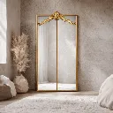Elegant gold-framed full-length mirror.webp