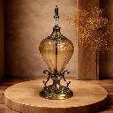 Intricate amber glass finial design.webp