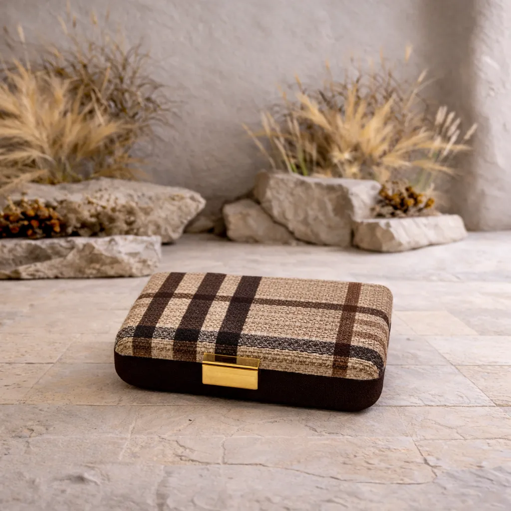 Plaid box on outdoor stone floor.webp
