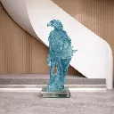 Glass eagle sculpture in modern setting.webp