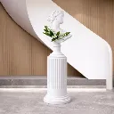 Elegant Greco-Roman bust vase arrangement.webp