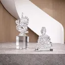Crystal dragon and Buddha figurines.webp