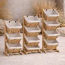 Wicker storage units on stone patio.webp