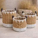 Woven baskets on stone patio.webp