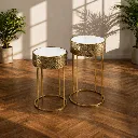 Minimalist tables with brass accents.webp