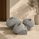 grey stone pebble-shaped planters.webp